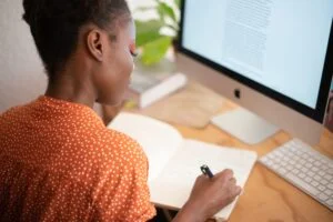 Ethnic lady working at desk at home