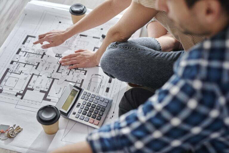 Close up of couple calculating costs of new house