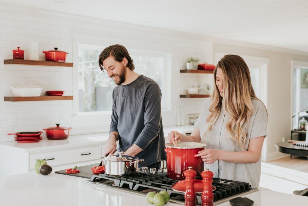 Couple cooking in the kitchen, smiling